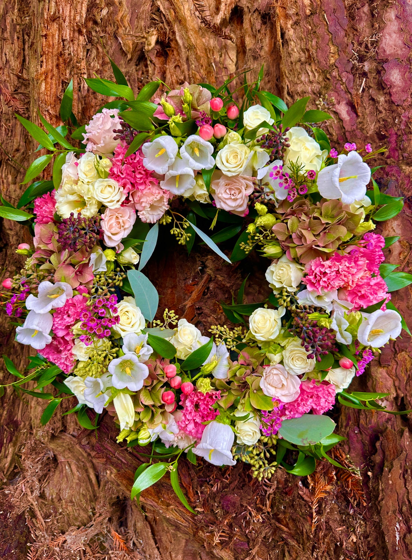 Floral wreath with pink and white with foliage