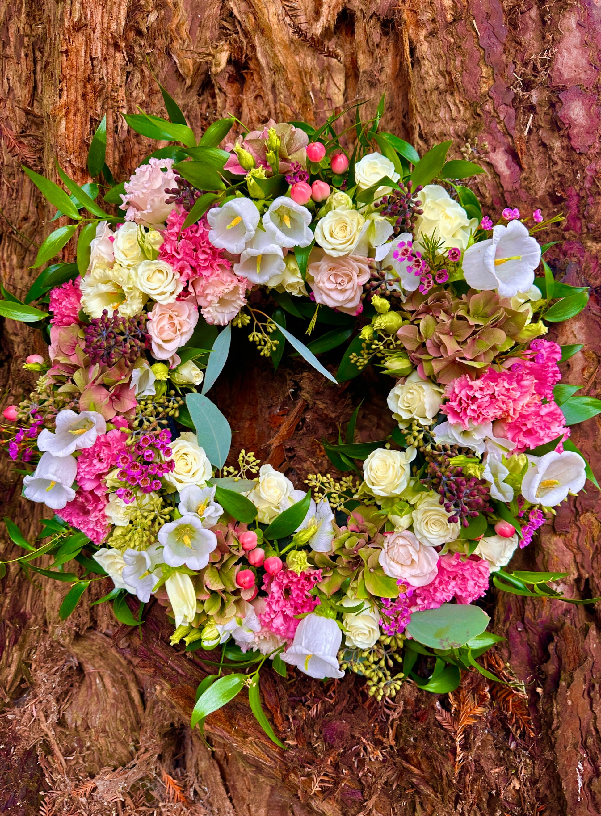 Floral wreath with pink and white with foliage