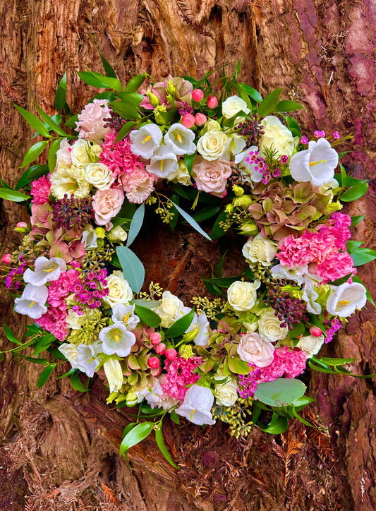 Floral wreath with pink and white with foliage