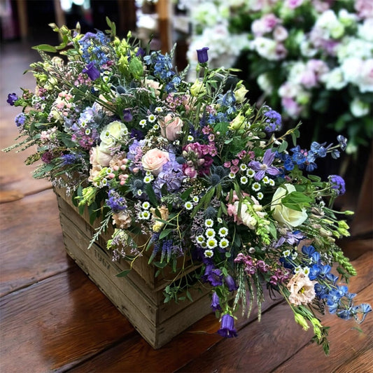 Soft pinks, purple, blue and white floral spray