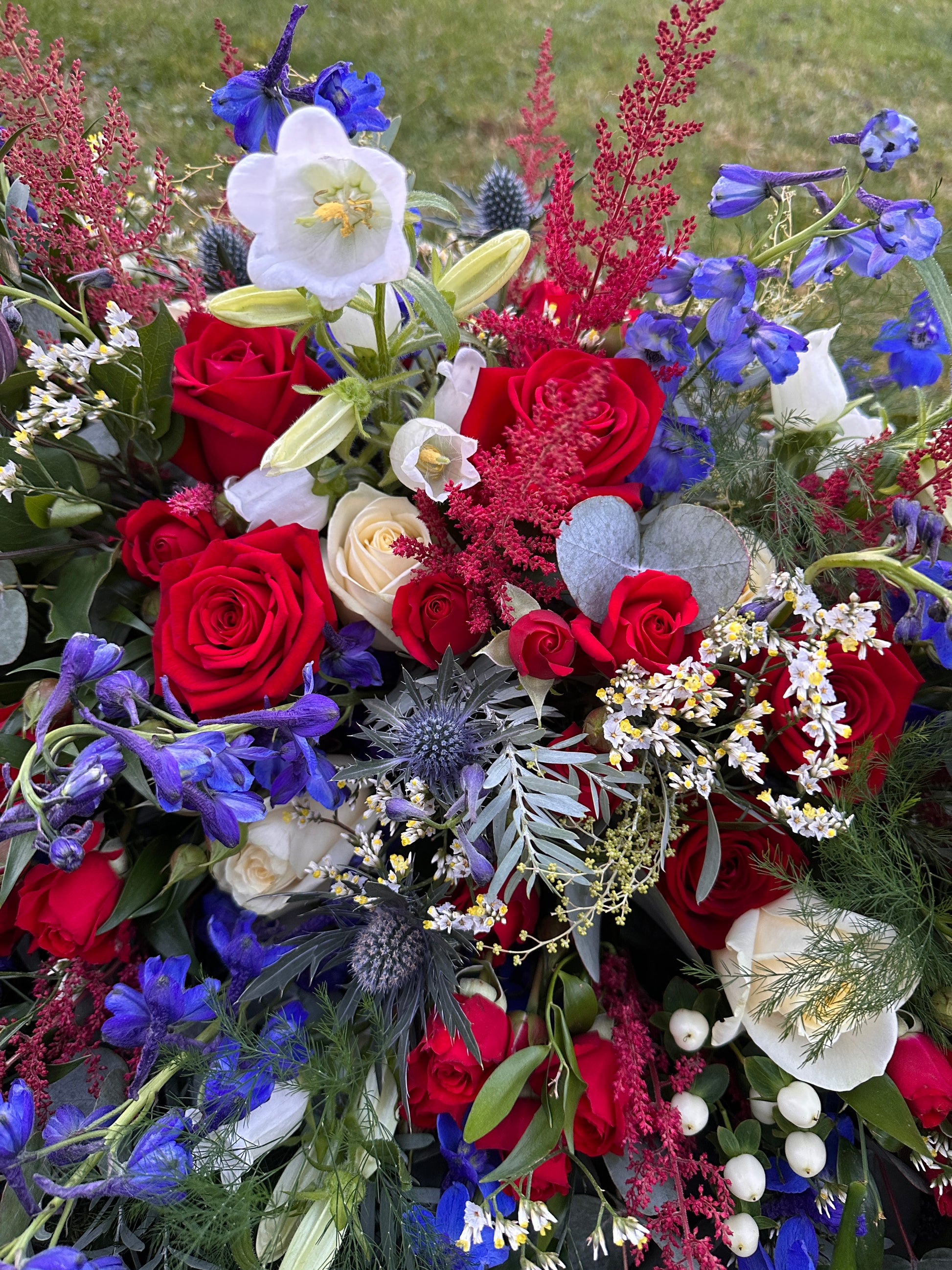 Red, White and Blue flowers for casket spray