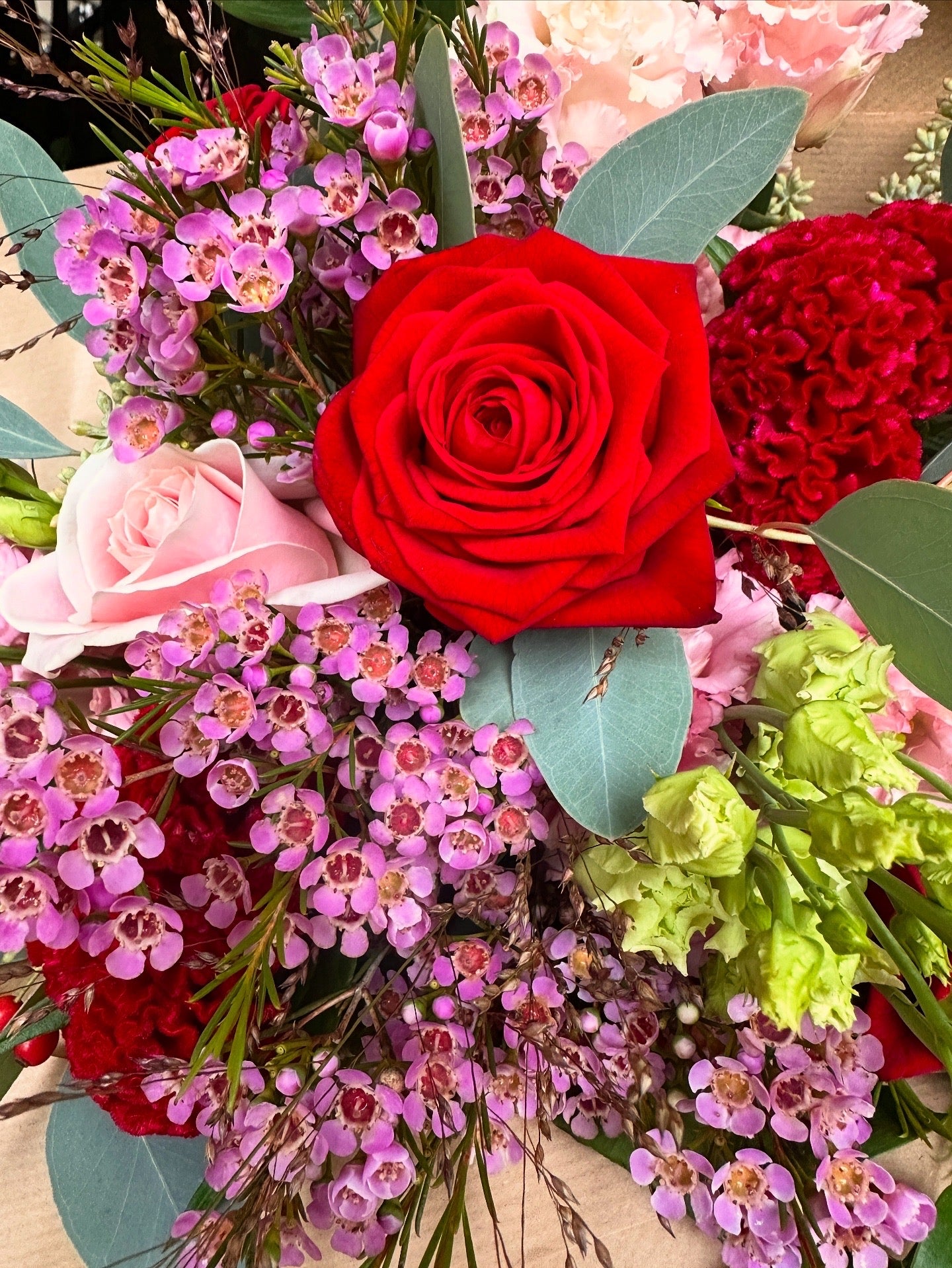 Pink and Red Flowers presented as a bouquet 