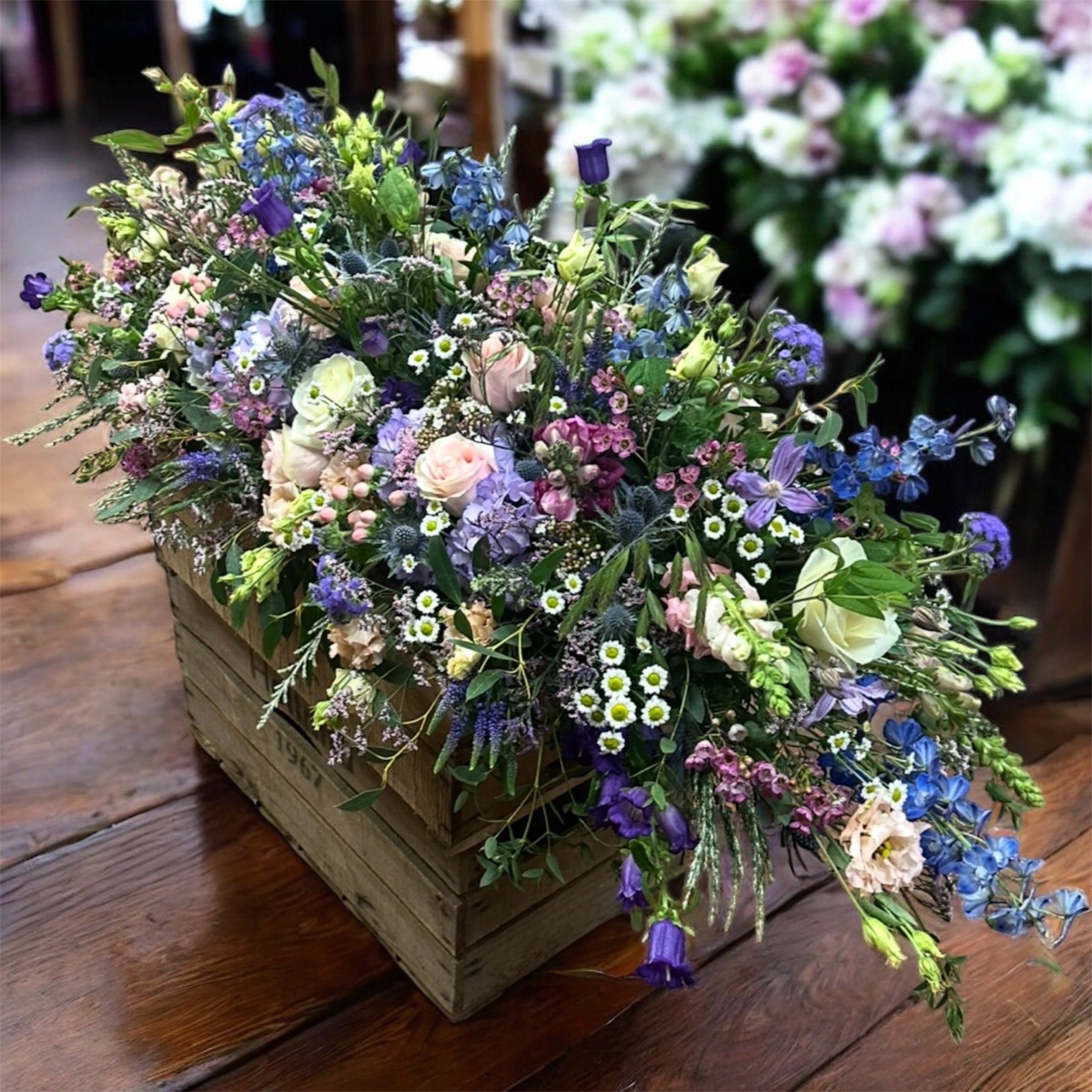 Country Blues Casket Spray - Blues, lilac, white and soft pink