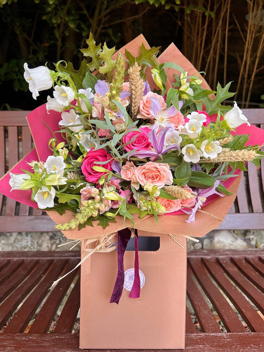 Floral bouquet in shades of hot pink, soft pink lilac and whites