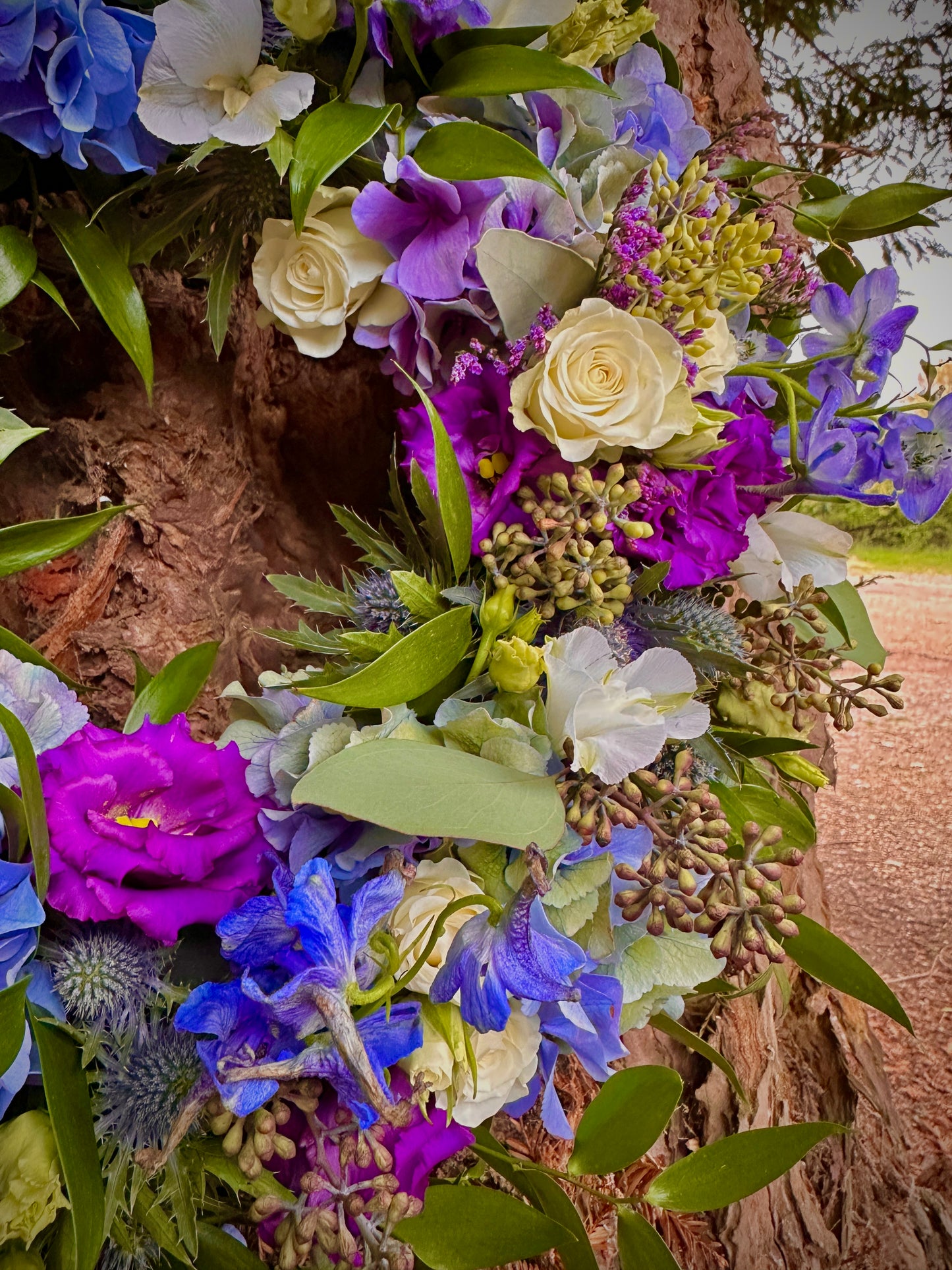 Blue, purple and white floral wreath