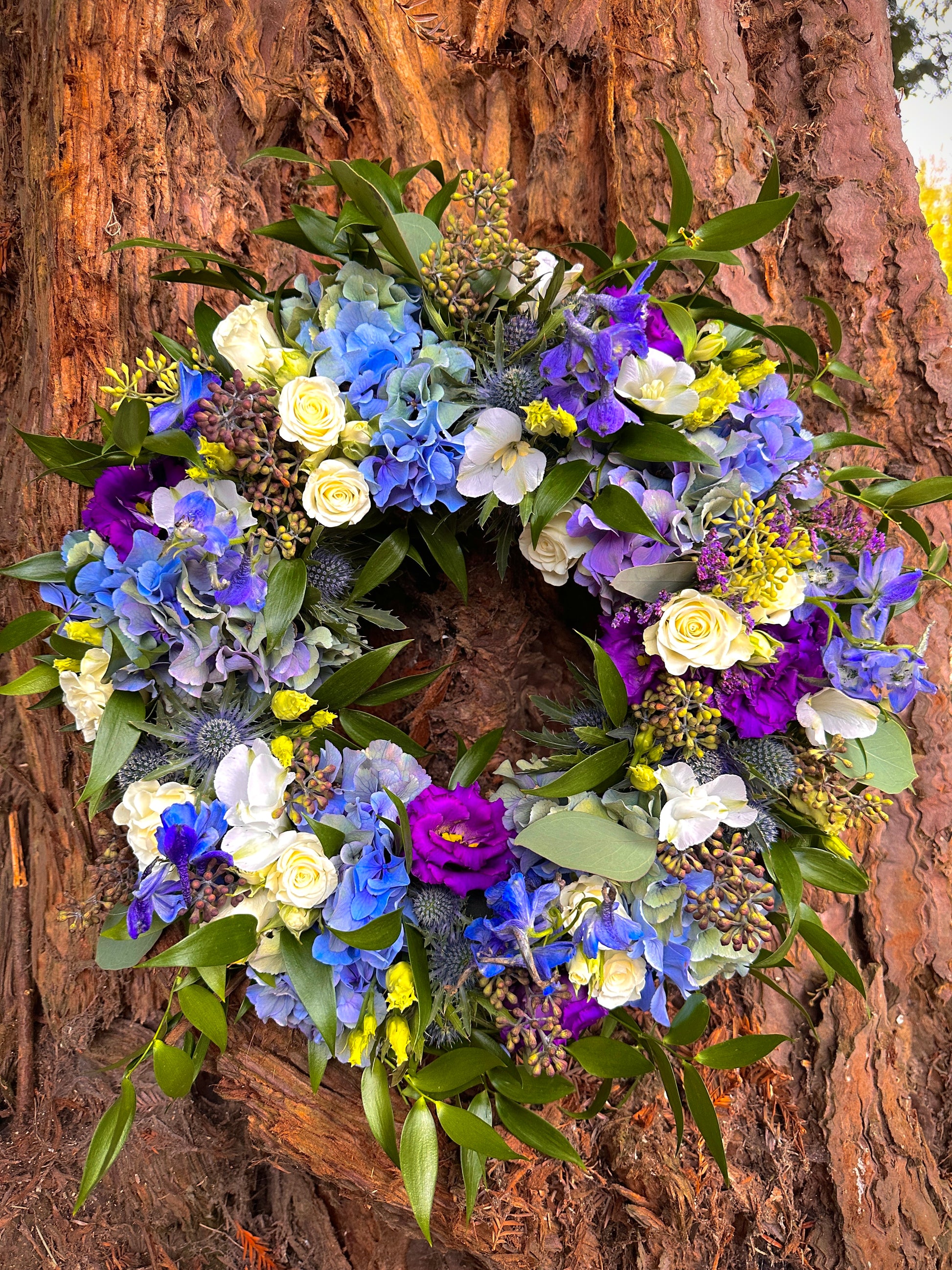 Blues purples and white floral wreath